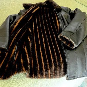 Black leather coat and gloves. Coat is a medium- outer shell genuine leather.